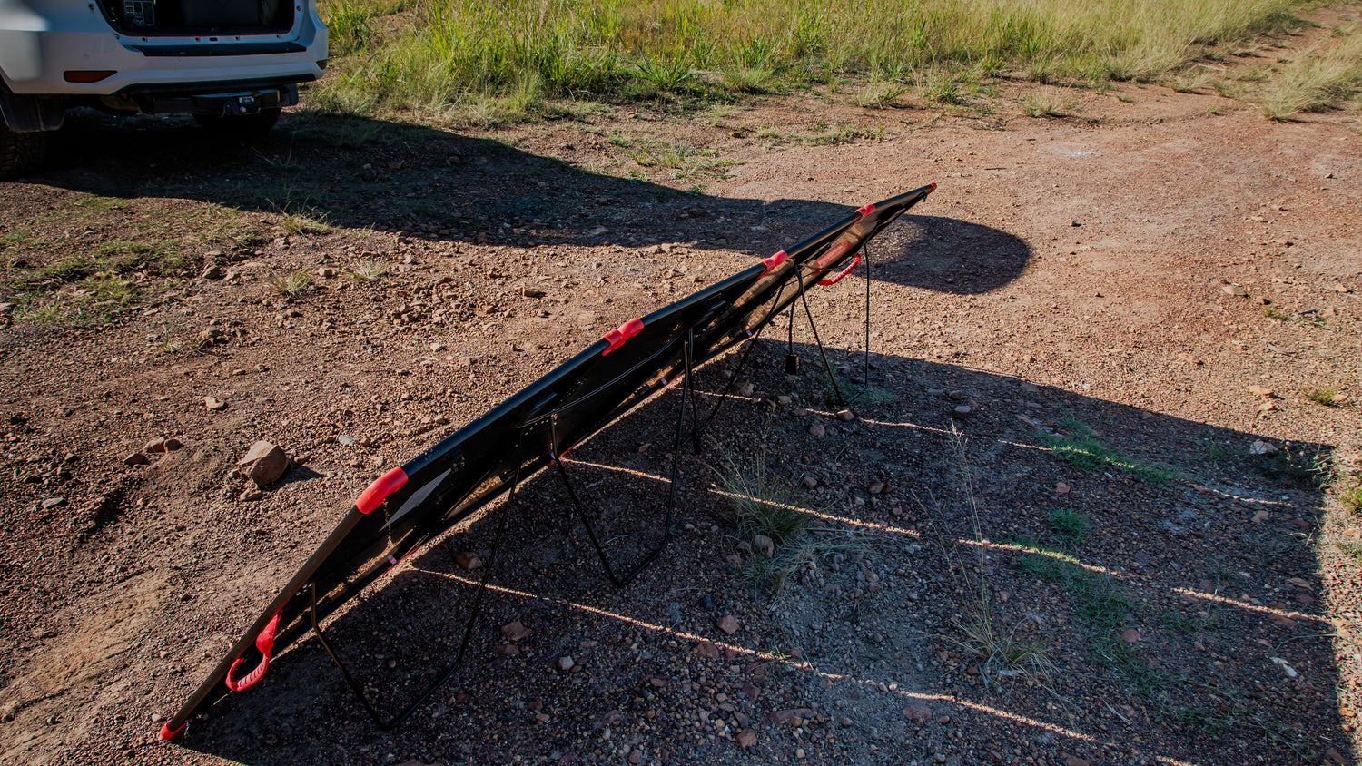 Car with deployed 400W camping solar panel