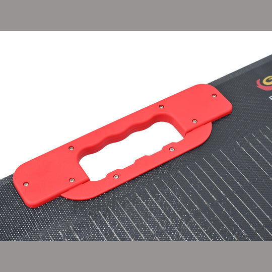 Red handle on a black textured surface with a visible brand logo. FlexoSun165W